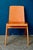 Made entirely of wood and finished in an ultra-bright golden hue, these vintage chairs have a striking allure. Their clean...