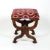A carved mahogany curule-form upholstered stool with new velvet upholstery. The curule-form stool with intricately carved...