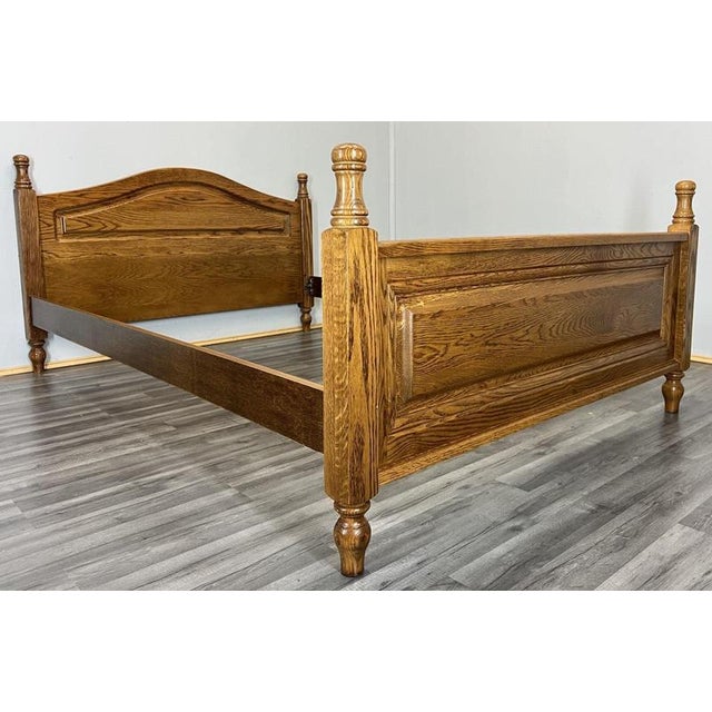This elegant Vintage French double bed frame showcases classic proportions and a warm, rich wood finish, offering timeless...