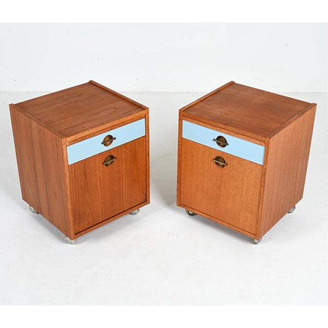 A pair of 1970's Danish Modern bedside tables by Axelsens Mobelfabrik for W & B Mobler. The tables are made of teak and...