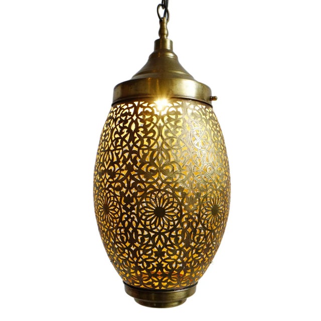 Unique intricate vintage brass pendant lantern with hand cut and etched perforated traditional design. Obelisk oval shape...