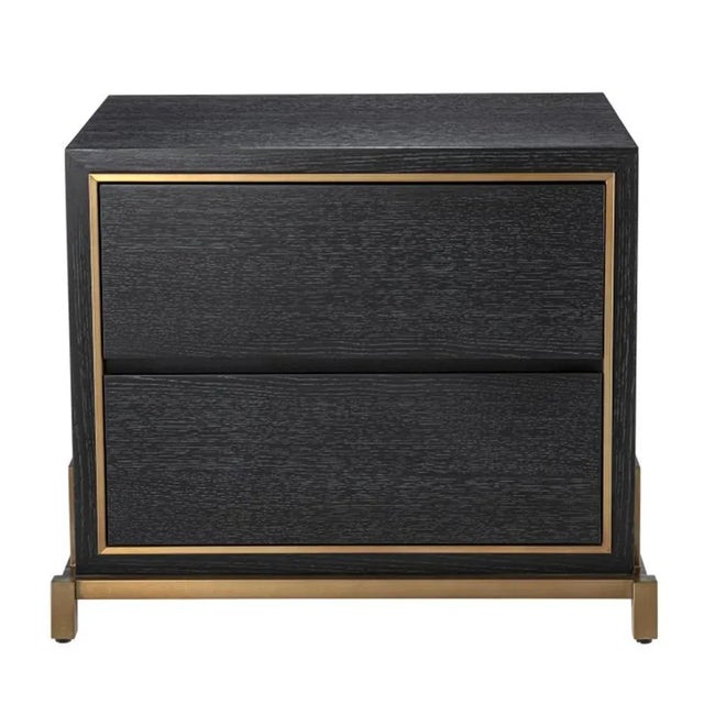 Bedside Table Zael is a chic and organised nightstand. Wrapped in a charcoal oak veneer casing and embellished with a...
