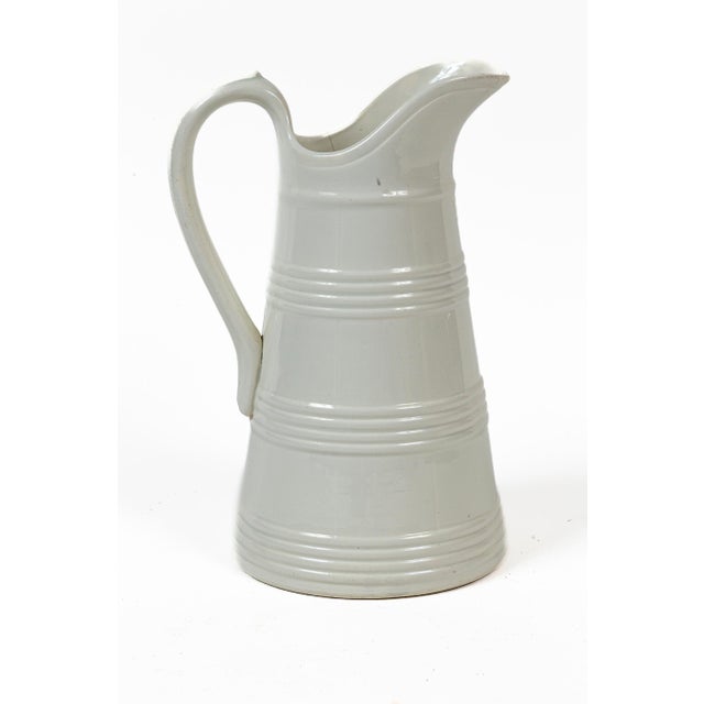 Tall Antique White Ironstone Dairy Pitcher, Boch Freres, Belgium, circa 1890. Grand size pitcher with raised bands and...