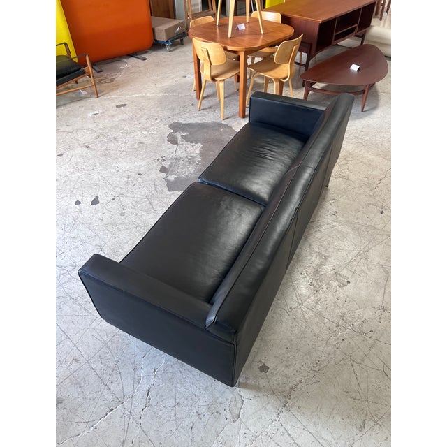 Black leather and chrome "Theatre Sofa" by Design Within Reach. This modern and timeless sofa features the softest black...