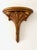Mid Century Hollywood Regency gold wall shelves. The shafts feature elegant fluting leaves below a demilune shelf. Great...