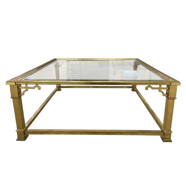 A Mastercraft style square coffee table highlighting bold elegance and craftsmanship. The table features a substantial...