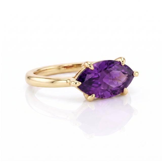 Elevate your everyday look with the regal beauty of rich purple. This eye-catching ring showcases a brilliant, eye-clean...
