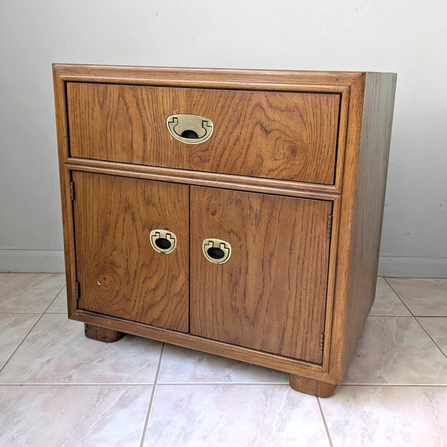 A vintage 1980's burled oak nightstand from the Passage Collection by Drexel.
