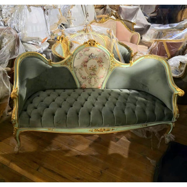 Bring timeless French elegance into your home with this exquisite Louis XV-inspired three-seat sofa. Upholstered in...