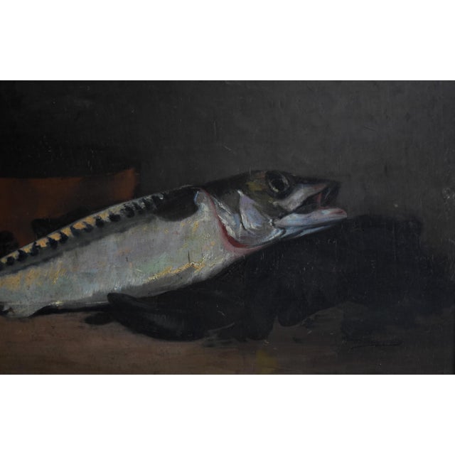 A striking late 19th-century French still life by Joseph de Ruysscher (1840–1905), featuring a freshly caught fish laid...