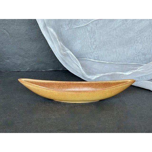 A scarce find, this vintage Hyalyn art pottery vase has a modern crescent shape designed for an Ikebana floral...