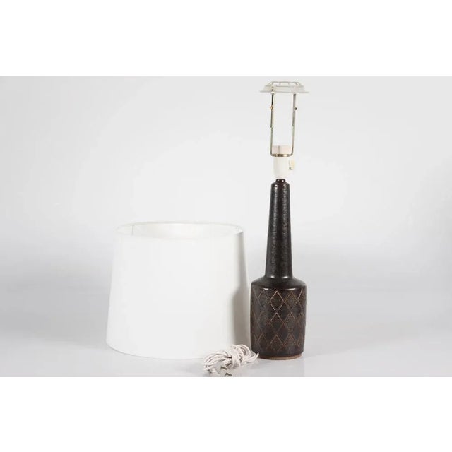 Mid-century table lamp model dl 32 from danish palshus including a new lampshade. the lamp is designed by per linnemann-...