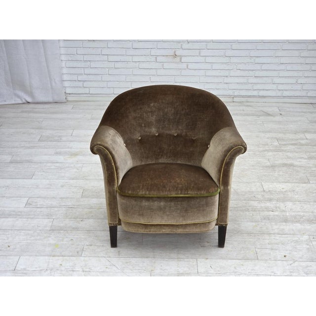 1960s, Danish armchair. Original green furniture velour, beech wood legs, brass springs in the seat. Original good...