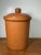 Authentic Portuguese terracotta pottery jar with lid, featuring a simple rustic form and warm clay glaze. Handmade from...