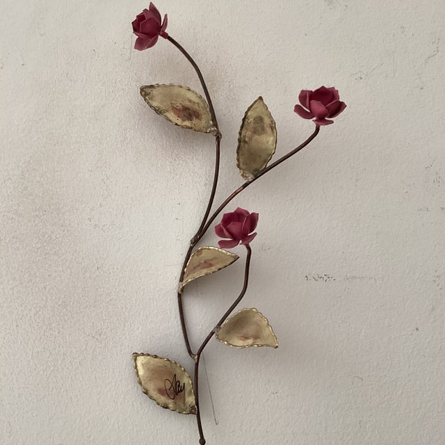 The product is a rare vintage enameled floral wall sculpture by Curtis Jere from the 1960s. It is an original piece signed...
