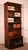 Elegant oak stacking bookcase from late 19th/early 20th century England, featuring six sections and a projecting shelf....
