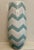 Make a bold statement with this stunning vintage ceramic floor vase featuring a striking teal and white zigzag pattern....