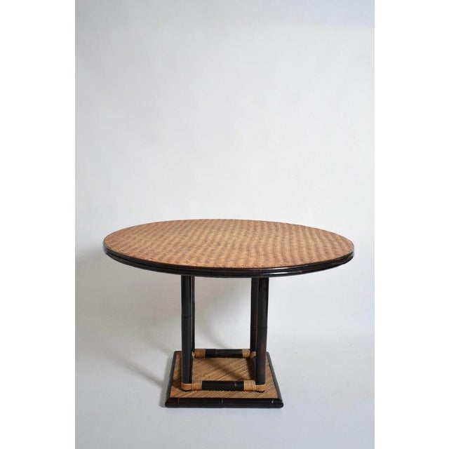 Bicolor round rattan dining table, 1970s. Height: 76 cm - 29.92 in Diameter: 118 cm - 46.46 in