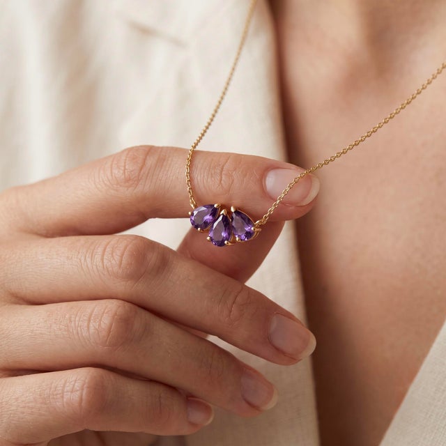 Product Overview Add a touch of regal elegance to your jewelry collection with this stunning cluster pendant necklace,...