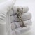 Enchanting and rich in narrative charm, this vintage silver figurine depicts Pinocchio heading off to school while holding...
