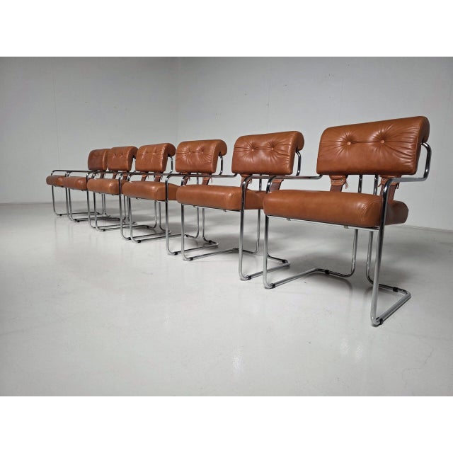 Set of six “Tucroma” dining chairs designed by Guido Faleschini for i4 Mariani, Italy, circa 1970s. Featuring rich cognac...