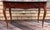 The rectangular top is made with 2 wide planks, extended and rounded front corners, and a subtle molded edge around three...
