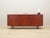 The sideboard was made in the 1970s, Danish production. The structure is covered with teak veneer. Legs made of solid wood...