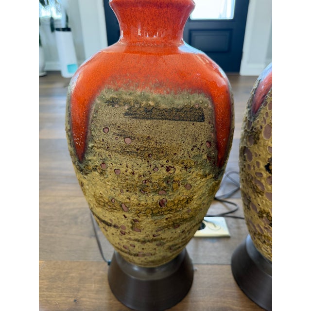 Absolutely stunning pair of vintage mid century modern ceramic table lamps featuring a bold lava / drip glaze in rich...
