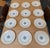 Design Plus Gallery presents a Set of Twelve English Pottery Charger Plates, Stamped by Mintons. The plate has a detailed,...