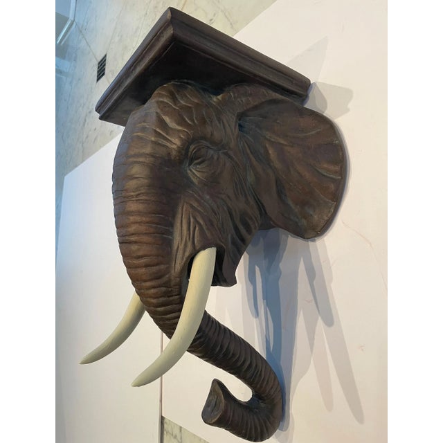 Sensational pair of painted composition elephant form wall brackets having beautiful detailing. Acquired from an upper...