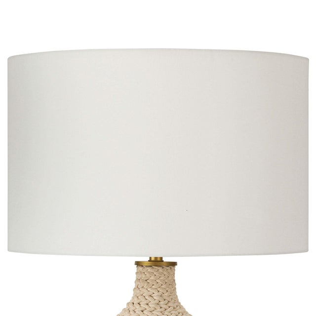 With nautical charm and modern sensibility, this table lamp features a large bulb shaped body, which is hand wrapped with...