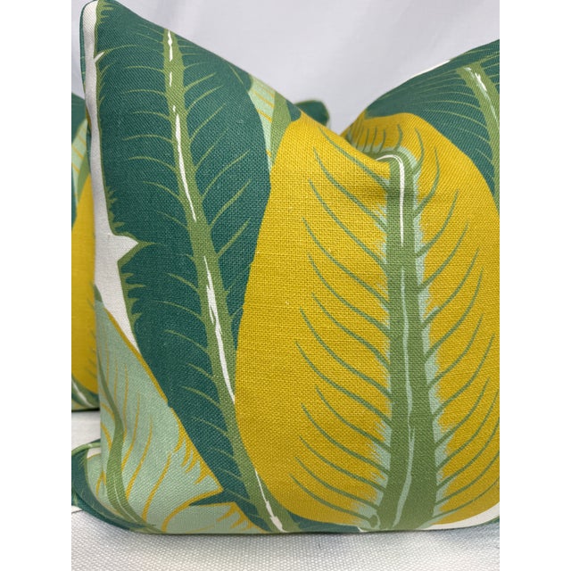 Custom pair of 22" pillows covered in Schumacher "Tropical Isle" in color green on ivory linen. These pillows are self...
