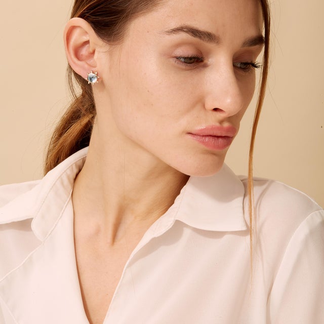 Created in 18 karat yellow gold Blue Topaz cabochons 4 carats approx. Diamonds 0.10 carat approx. 18kyg butterfly backs...