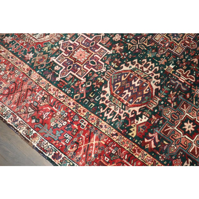 A mid-20th-century Green Field Geometric Heriz Rug