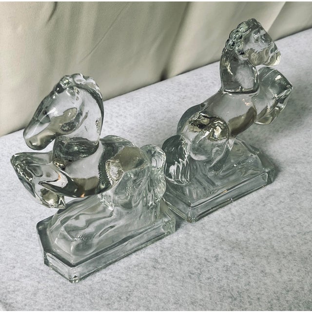 This is a pair of beautiful vintage, glass, rearing horse bookends. They are heavy and of high quality glass, attributed...