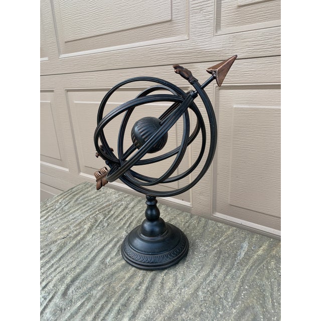 A beautifully crafted iron armillary sphere, evoking the timeless elegance of classical European gardens. Pieces like this...