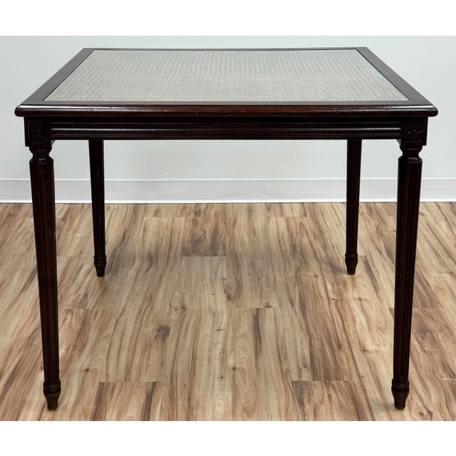 Vintage square French style carved wood game table. Features rich natural wood finish, beautiful aged beveled edges,...
