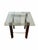 Elegant Mid-Century Modern table attributed to Heinz Meier, featuring a glass top supported by wood legs with chrome...