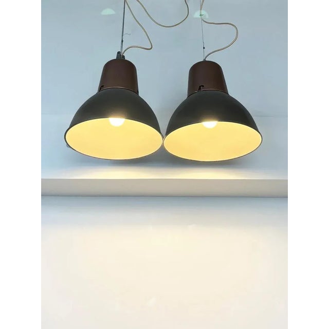 Industrial Lamp. The lamp has two pieces, the bottom one is black and white original enameled, and the top part has been...