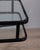 Black metal trolley table with double clear glass shelf, adjustable height, designed by Allegri Parma, 1970s. This piece...