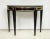 Bespoke Pair of Ebonized and Brass-Banded Demilune Consoles in the Neoclassic Manner We can make these consoles to your...