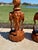 C. 1960s pair of carved teak elephant and lotus form table lamps. Both in excellent condition. One lamp has lost two...