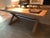 Custom made 72" long bleached oak and steel dining table. 3" thick edge, legs recessed back from the edges approx 3". Copy...