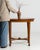 A circa 1900 French side table in the Sheraton Revival style, featuring a rectangular top and a structured frame with...