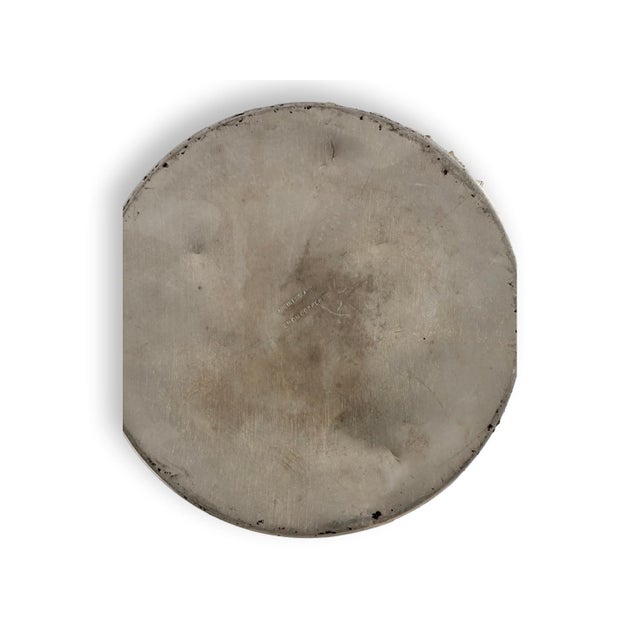 A stately pair of English silver-plated candlesticks over copper, featuring a classical tapering column and stepped base...