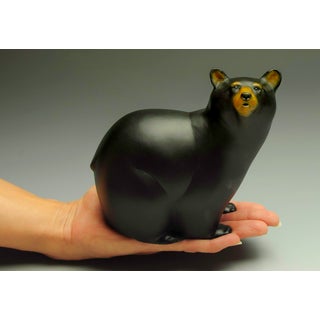 Bear Handed by Jeremy Bradshaw | Bronze sculpture of a black bear in a hand. For Sale