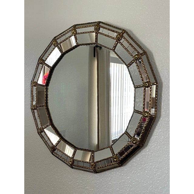 Rare find! This is a gorgeous Venetian Italian ornate mosaic mirror in brass frame from the mid 20-century era. The mirror...