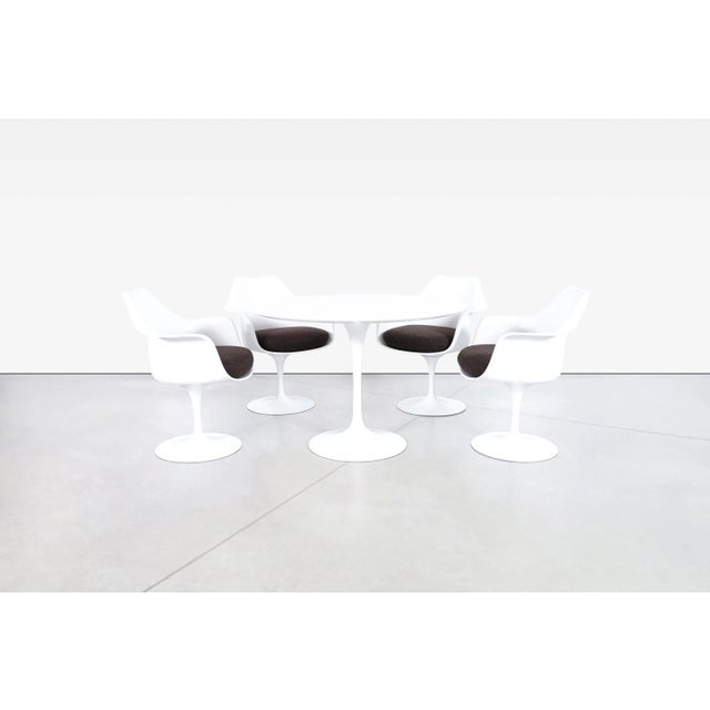 Designed by Eero Saarinen for Knoll International, this exceptional mid-century modern Tulip dining room set is one of the...