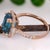 Metal 6.6Ct Blue Zircon Diamond Halo Ring in Solid 14k Gold – Emerald Cut, 10x7mm, Size 6.75 For Sale - Image 7 of 7