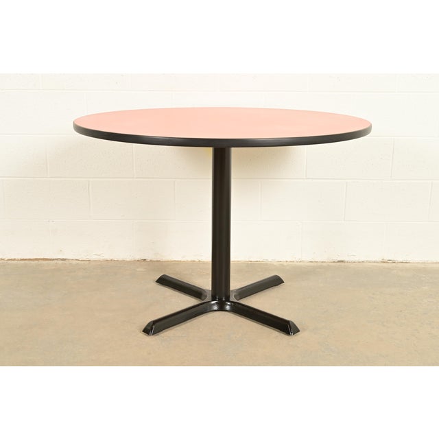 A sleek and stylish Modern or Mid-Century Modern round dining table, breakfast table, bistro table, or game table In the...